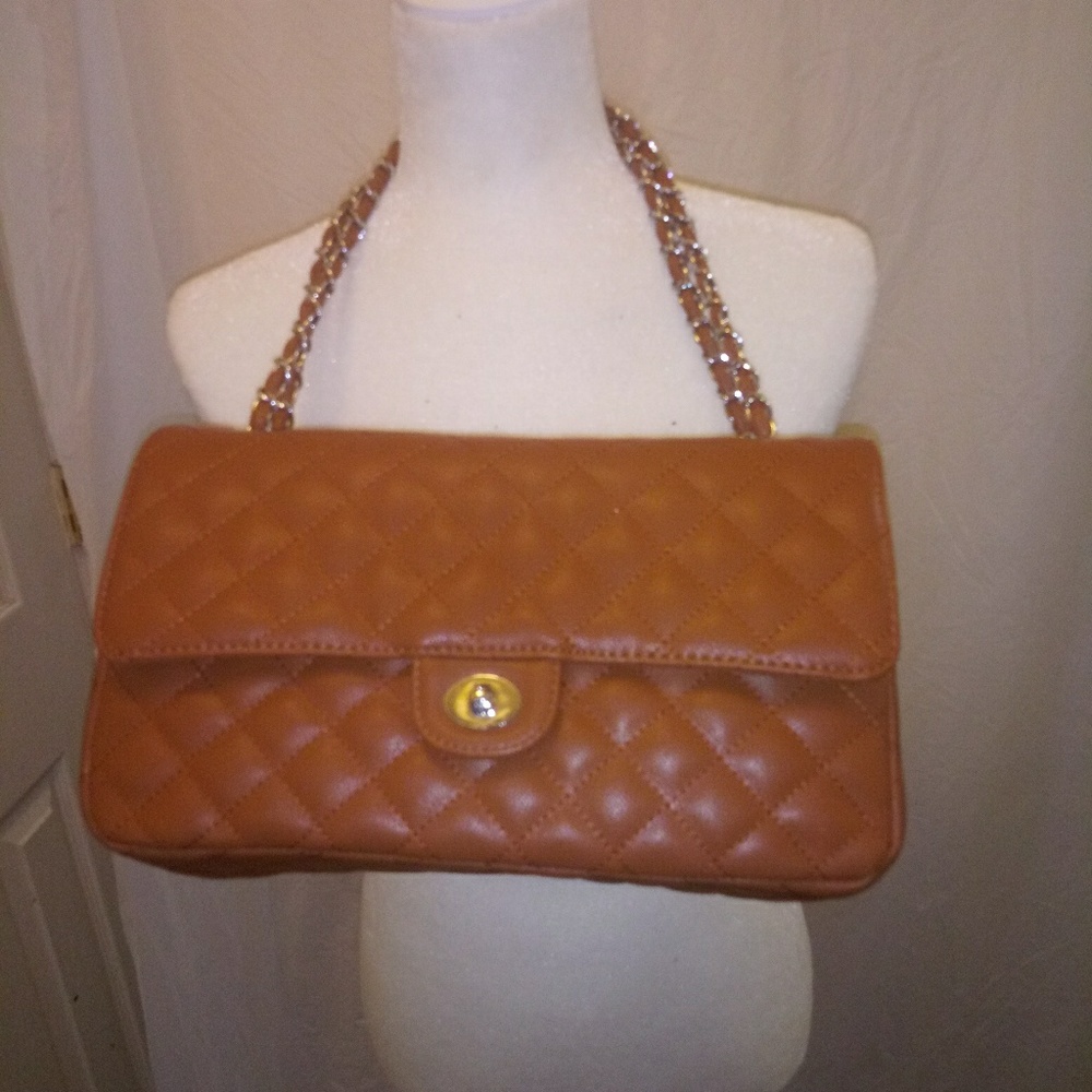 A tan chanel like a like large purse nicely made